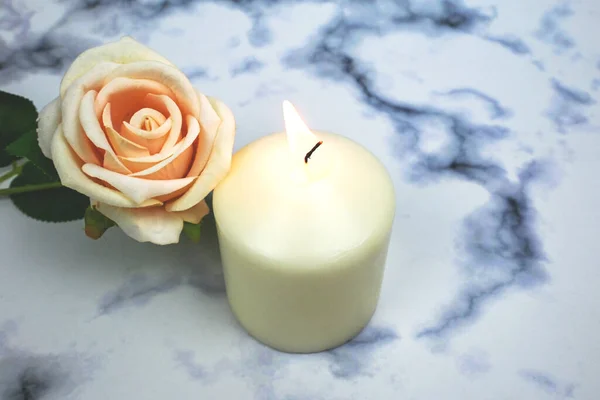 Orange old rose and white soy wax candle flame, creating aroma therapy sensory , good vibes atmosphere enviroment, home decoration, rituals and spells, relaxation and peaceful moment. spa healing.