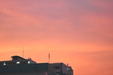 Beautiful sky sunset in the urban city in the evening. Colourful sunset twilight cityscape.