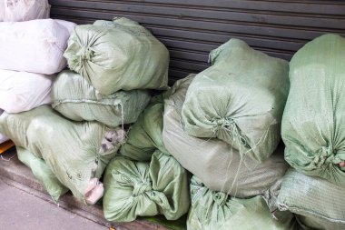 Hemp sacks packing, all kind of products waiting for delivery along the street.