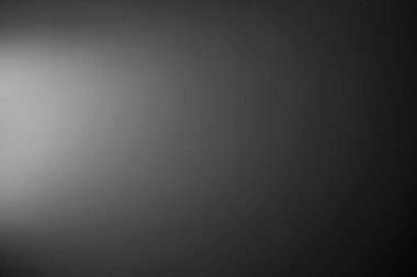 Koyu siyah ve gri arka planda biraz soyut ışık var. duvar kağıdı, tasarım, grafik ve sunum için yumuşak arkaplan