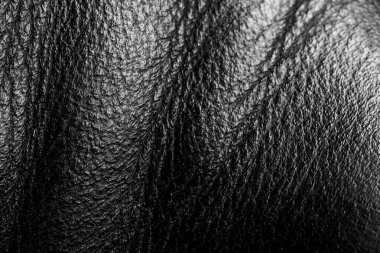 Esnek siyah derili parlak doğal siyah dalgalar arka plan deseni soyut yakın plan, lüks siyah inek derisi arka plan