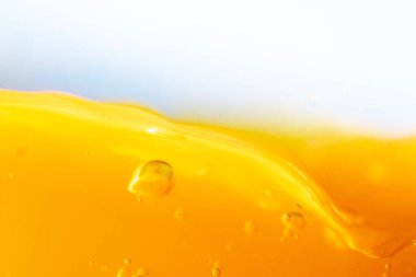 Parlak portakal suyu dokusu, sağlık ve doğa dalgaları, güzel dalgalar eğrisi ve garfik tasarım ve arka plan için pürüzsüz küçük kabarcıklar.