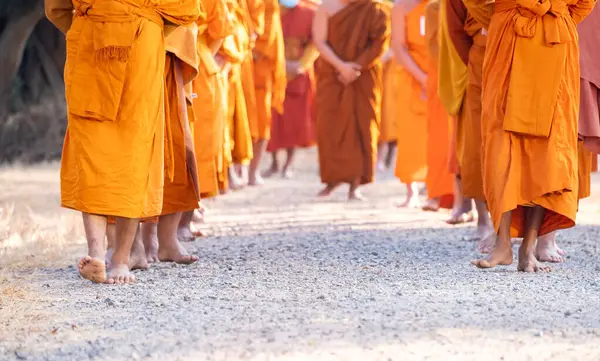 Monks walking for meditation, practicing religious physical exercises, performing religious ceremonies, dressing, praying.