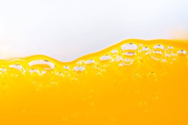 Parlak portakal suyu dokusu, sağlık ve doğa dalgaları, güzel dalgalar eğrisi ve garfik tasarım ve arka plan için pürüzsüz küçük kabarcıklar.