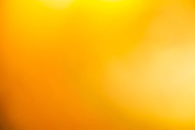 Açık sarı ve altın rengi pürüzsüz arka plan lüksünün biraz soyut bir ışığı vardır. Grafik tasarımı için günışığı gölge arkaplanı modern, ürünler için boş duvar kağıdı şablonu