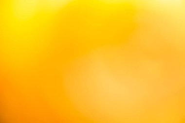 Açık sarı ve altın rengi pürüzsüz arka plan lüksünün biraz soyut bir ışığı vardır. Grafik tasarımı için günışığı gölge arkaplanı modern, ürünler için boş duvar kağıdı şablonu