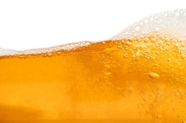 Parlak portakal yağını veya birayı kapat doku ve doğa dalgaları, güzel dalgalar eğrisi ve grafik tasarım ve arka plan için pürüzsüz küçük kabarcıklar, yağlı baloncuklar, yumuşak bira kabarcıkları, seçici odaklanma