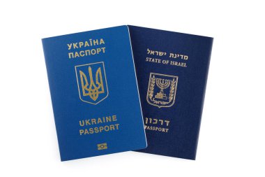 Israeli and Ukrainian foreign passports isolated on white background. Closeup. clipart