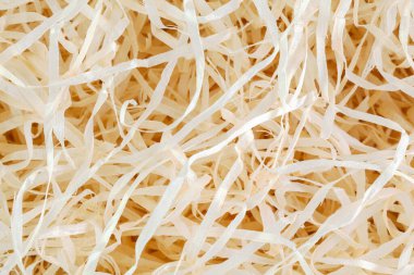 Wood background. Close up of wooden shavings for packing.
