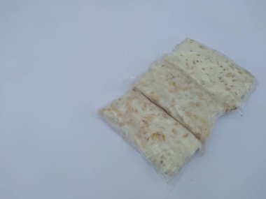 Tempe in plastic packaging, Tempe is a traditional food from Indonesia and is made from raw soybeans
