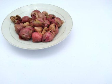 fresh shallots in a white plate