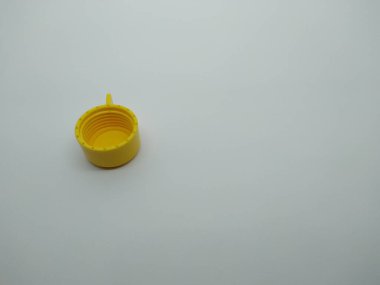 yellow plastic bottle cap