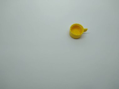 yellow plastic bottle cap