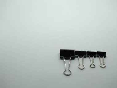 large and small paper clip binders