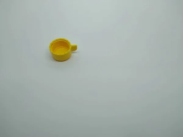 yellow plastic bottle cap