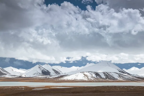 stock image snow in mountains, landscape, sky, clouds