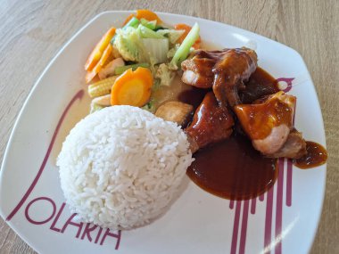 Surabaya-October 28, 2023: Some of the menus from the Solaria restaurant include nasi ayam goreng mentega, nasi goreng cabe hijau, and fu yung hai.