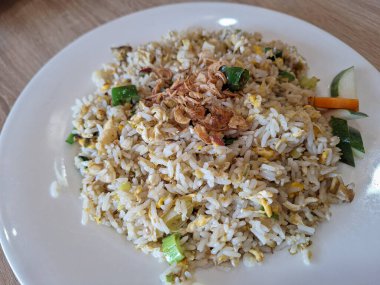 Surabaya-October 28, 2023: Some of the menus from the Solaria restaurant include nasi ayam goreng mentega, nasi goreng cabe hijau, and fu yung hai.