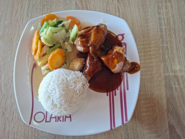 Surabaya-October 28, 2023: Some of the menus from the Solaria restaurant include nasi ayam goreng mentega, nasi goreng cabe hijau, and fu yung hai.