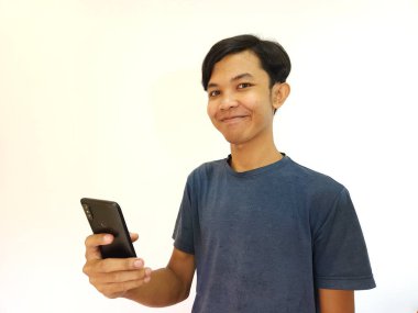 Wow and surprise face asian man use smartphone with copy space of advertisement