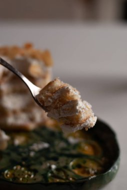close up of a plate with a spoon of white beans