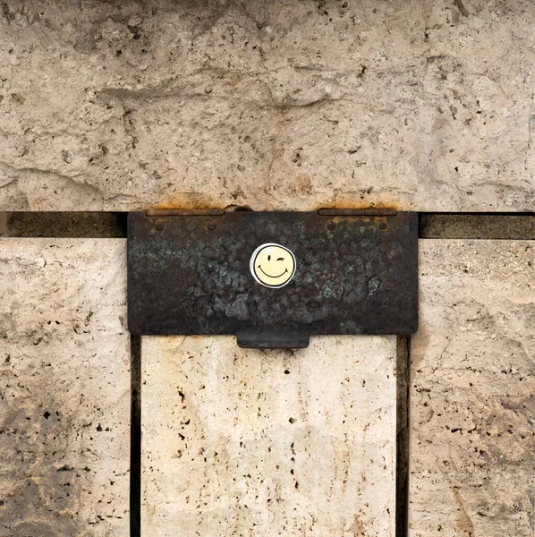 smiley on the mailbox of a family home. Don\'t forget to laugh!