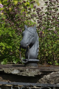 stone sculpture of an old house
