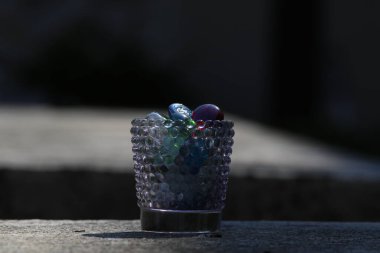 a close-up shot of a blue and black grapes with a white background