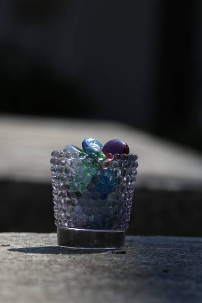 beautiful chocolate balls on the background of the dark wooden table.