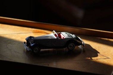 car toy on a wooden board. close up.