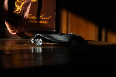 car driver with a red hood in the hand