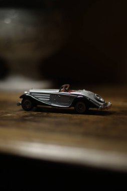 car toy with black leather, white background. close up.