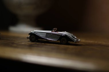 a toy car, a model of the red-and-colored cars in the form of a small