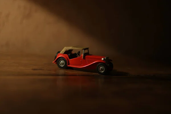 Red Toy Car Table Blurred Background — Φωτογραφία Αρχείου