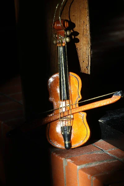 close up of an violin in the piano on a black background