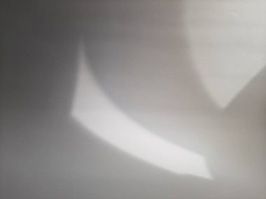 Blurred abstract grey or gray background with sunlight