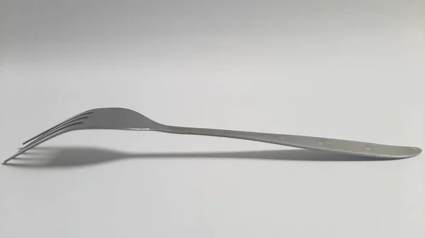 Metal or steel silver fork on isolated white background