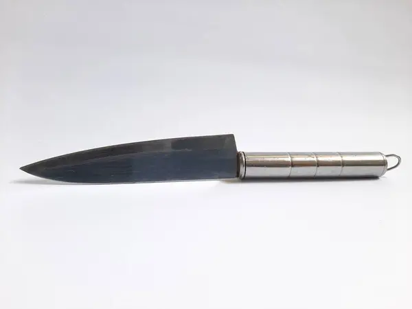 Single or one metal or steel silver knife on isolated white background with sunlight