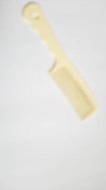 Blurred or unfocused or defocused white milk single or one comb on isolated white background