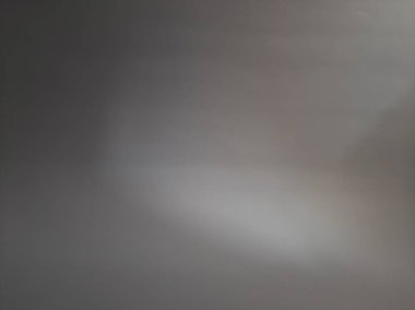 Blurred abstract grey or gray background with sunlight