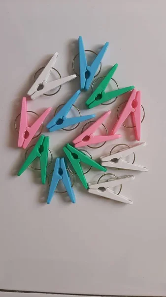 Colorful Plastic Clothespins or Cloth Clip Mixing Colors. Colour Clothes Peg. Home equipment.