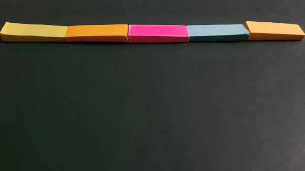 Pastel and Neon Sticky Notes or Paper Index or Page Marker or Flags Tabs or Note Adhesive Post Highlighter or Memo Pads for Highlighting Documents on Isolated Dark Background