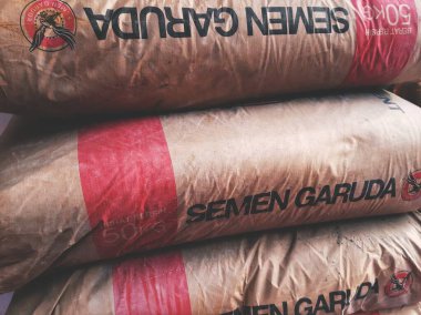 Ciamis, Indonesia - January 31, 2023 : stack of three cement bags for construction