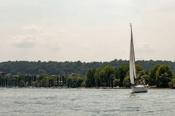 stock image man on his boat at the lake landscape