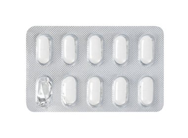Pharmaceutical drugs in started silver blister packing with one used pill, panel packs isolated on white background. Clipping path, close up.
