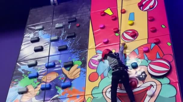 Boy Rises Climb Wall Rock Climbing Gym High Quality Footage — Stock Video