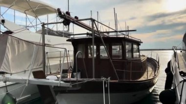 Old Wooden Fishing Boat Anchored At Harbor 