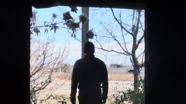 Silhouette Person Standing Abandoned Factory Entrance — Stockvideo