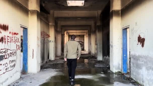 Person Entering Abandoned Factory — Stockvideo