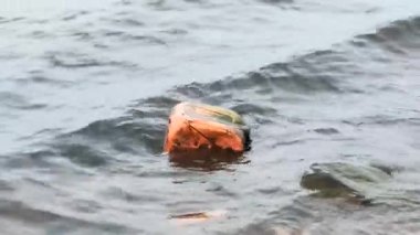 Plastic Container Washed Up On Beach 